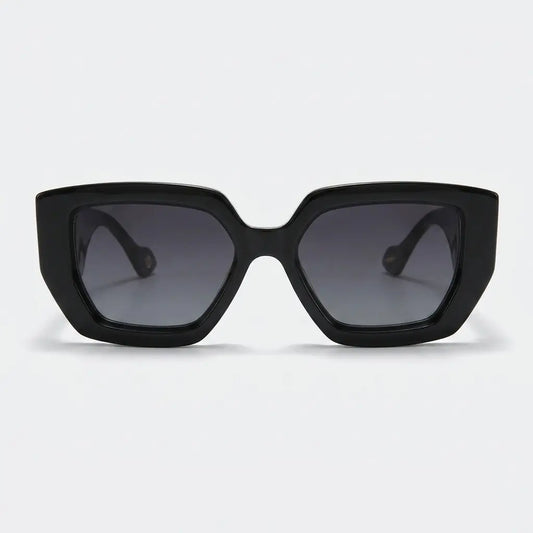 Black sunglasses with dark lenses on a light gray background