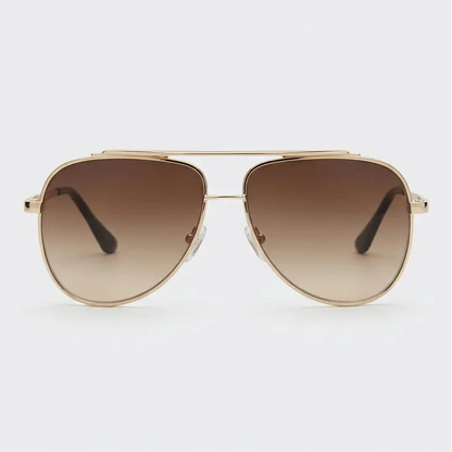 Aviator sunglasses with gold frame and brown gradient lenses on a light gray background
