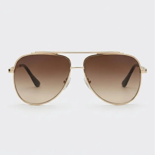 Aviator sunglasses with gold frame and brown gradient lenses on a light gray background