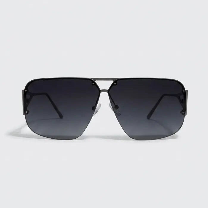 Sunglasses with a gradient black lens on a light gray background