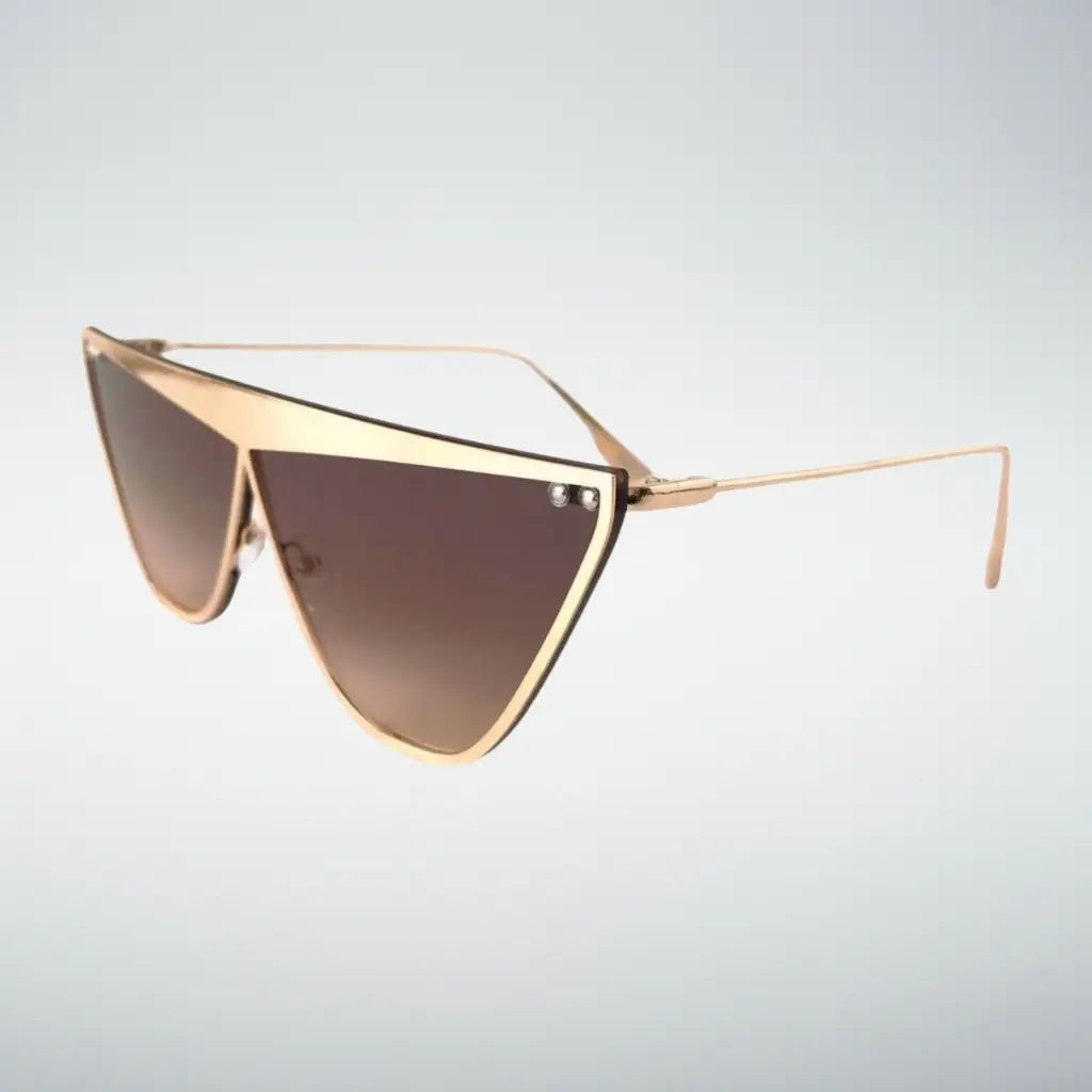A pair of angular shield-style sunglasses with a thin gold metal frame and gradient brown lenses, shown against a light gray background.