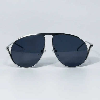 Sunglasses with dark lenses and thin metal frame on a light gray background