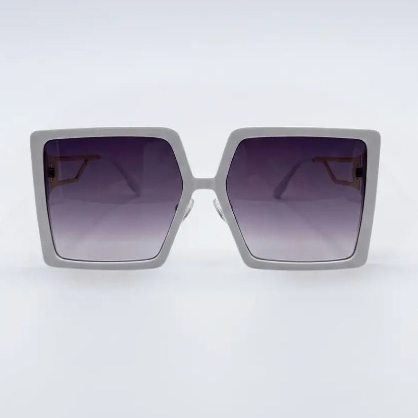 Sunglasses with a gradient purple lens on a white background