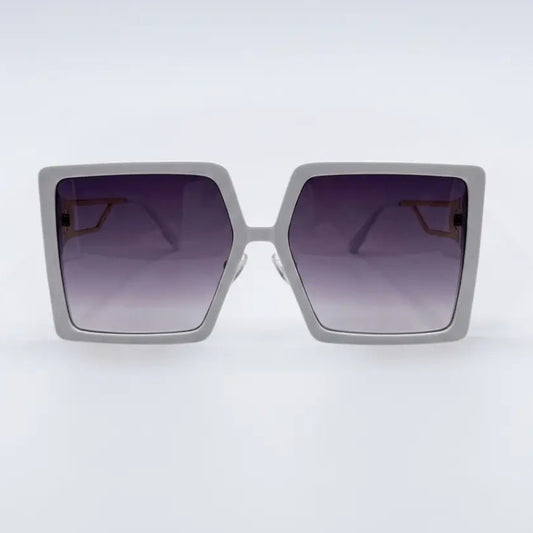 Sunglasses with a gradient purple lens on a white background