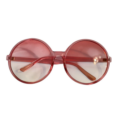 Round soft pink sunglasses with lightly tinted lenses that fade from pink to clear, displayed against a white background.